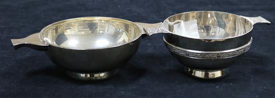 A modern silver quaich with Celtic motifs to handles and raised band and another silver quaich of plain form, total 11.7oz